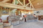 Elk Creek Retreat living  room with log beams.